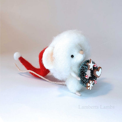 Adorable needle felted Christmas mouse in a Santa hat holding a wreath decorated with cookies/ White wool felted mouse keepsake decoration