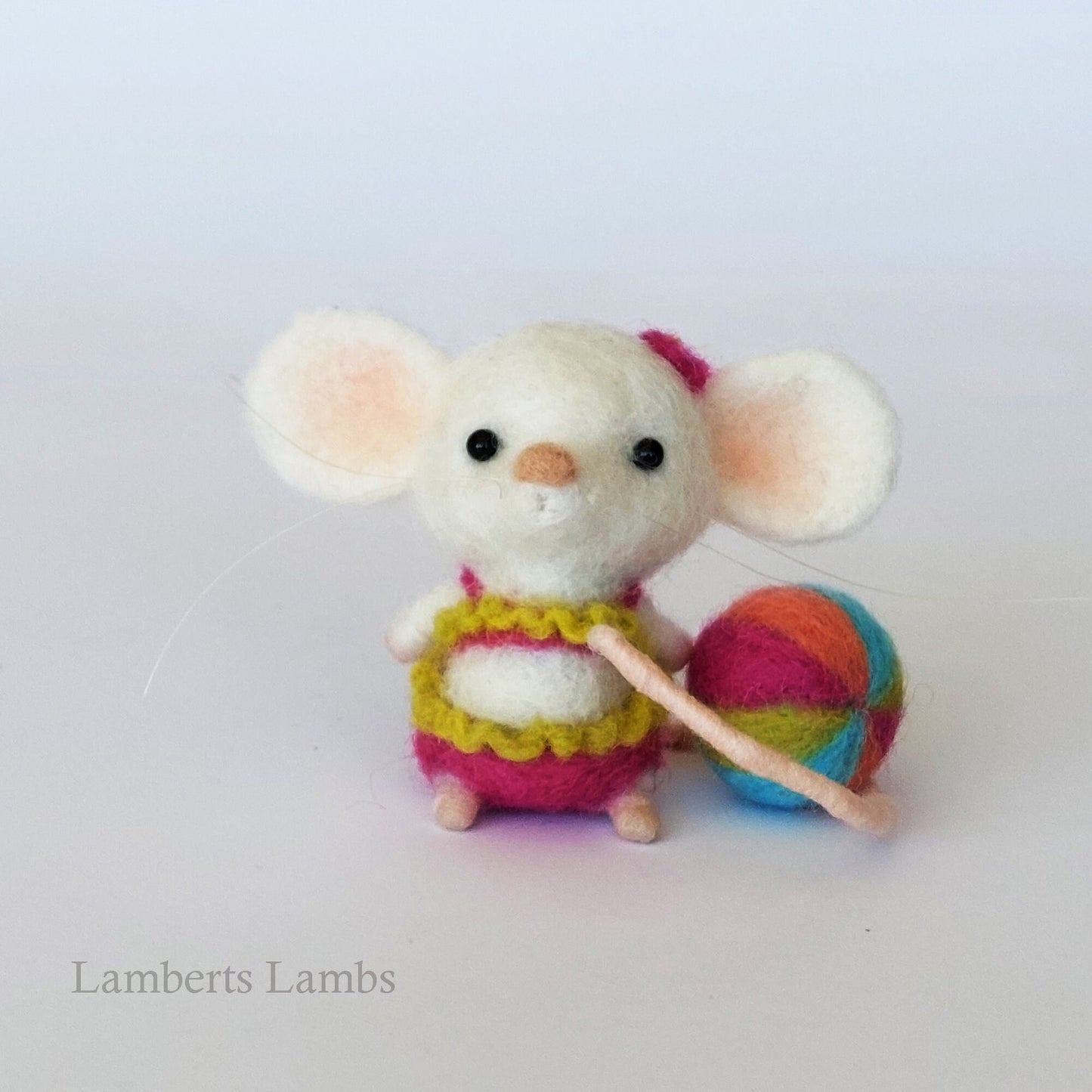 White needle felted mouse in a two piece swimsuit with a beach ball. Beach collection . Summer felted mouse.