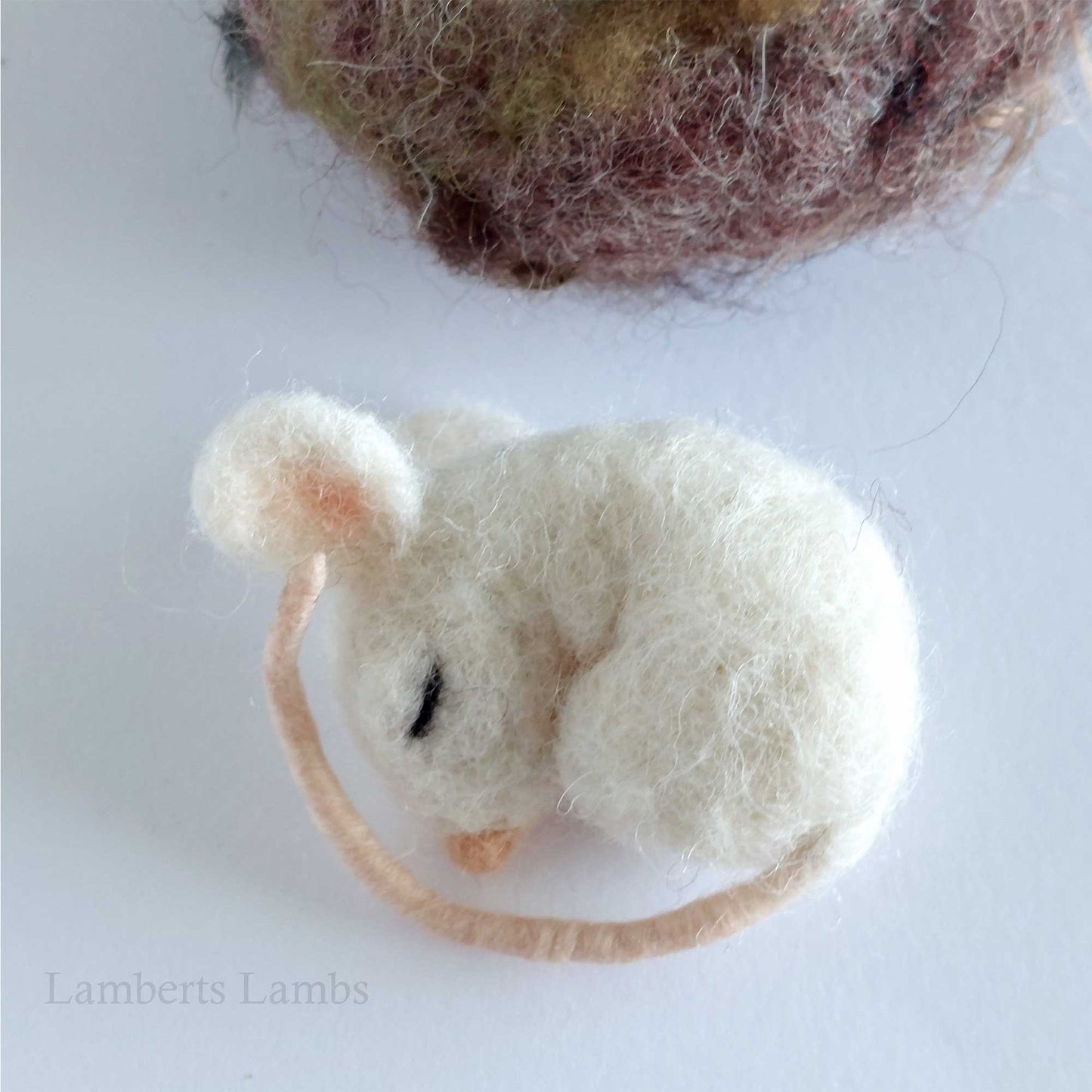 Needle felted baby mouse in a nest